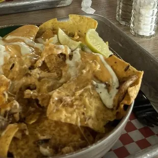 Nachos Your Way - with chicken, queso, shredded cheese, and sour cream