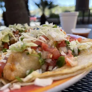 a plate of tacos on a table
