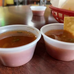 two bowls of soup and a tortilla