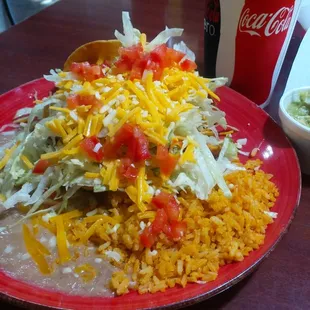 3 Crispy Tacos Ground Beef, Shredded Chicken, Shredded Beef. Rice and Beens