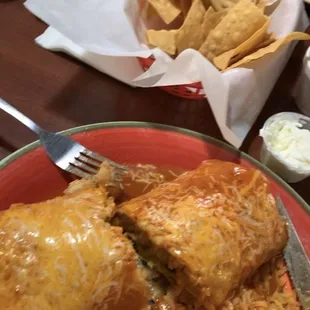 Wet Shrimp Burrito with a side of rice, chips &amp; guacamole with a side of sour cream, Menudo