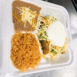 3 Roll taco plate combo #15 served with rice,beans,3 shed beef rolled tacos topped with guacamole,sour cream,cheese