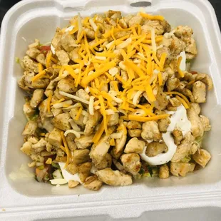 Salad Grilled Chicken Or (your choice meat)Served On Lettuce Guacamole Sourcream Pico De Gallo Topped With Cheese.