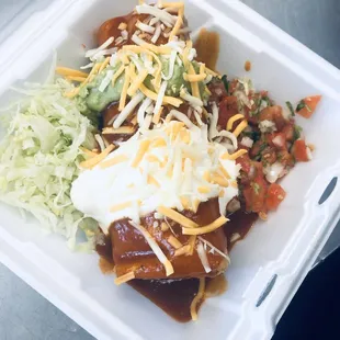 "Chimichanga" served with beans,cheese,your choice meat. Topped with enchilada sauce,sour cream,guacamole,lettuce,picó de Gallo and cheese