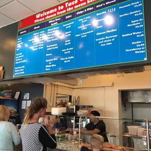 a woman and a child at a counter