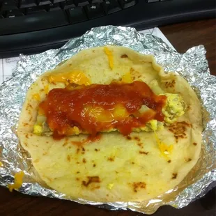 Sausage egg potato and cheese on homemade tortilla