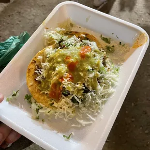 a person holding a plate of food