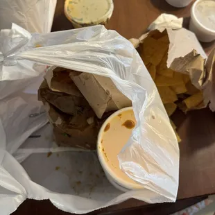 Birria jus all over the bag from poor packing