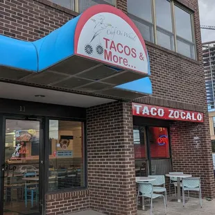 a taco zocalo located on the corner of a city street