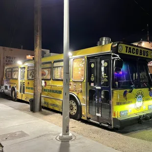 a taco bus parked on the side of the road