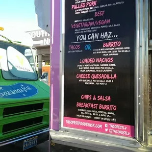 a taco truck parked in front of a restaurant