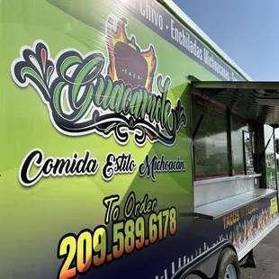 a taco truck parked in a parking lot