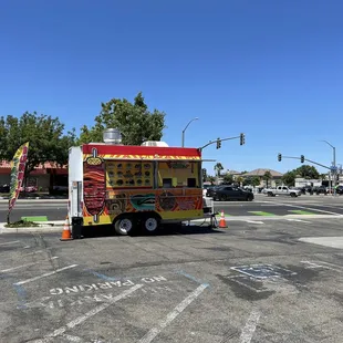 a taco truck in a parking lot