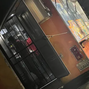 Guys on his phone before he starts to add onions and stuff on my food