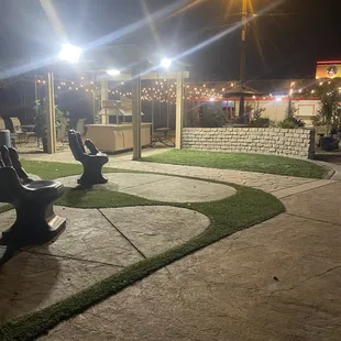 a couple of benches in a park at night