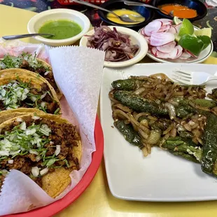 Tacos and fried chilis with onions