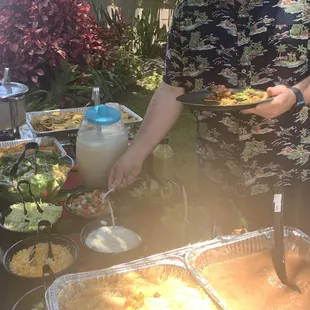 Taco toppings, nacho bar, sides and horchata.