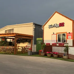 Store front and patio. 100% recommend coming, it is such a fun place to enjoy some outside time!! Food is amazing as well!!