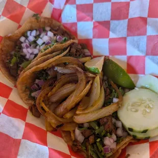 An order of steak street tacos. Love the flavor of these corn tortillas!