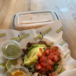 a taco with avocado and salsa