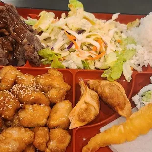 Lunch beef teriyaki bento with sesame chicken