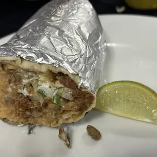 comes cut in half with a Lime, but don't forget to try the red and green sauce for the green sauce is much more spicy.