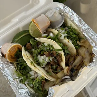 Pastor, beef fajitas, carne asada tacos (left to right)