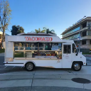 a taco truck parked in a parking lot