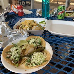 Asada tacos and nacho fries. Delicious! They offer several drink options.