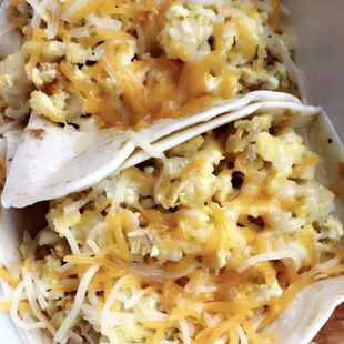 2 breakfast tacos. Egg, cheese and potato. Under $5