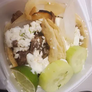 Steak tacos with HUGE pieces of ONIONS  no lettuce, no cucumber salsa, no cheese, no sour cream