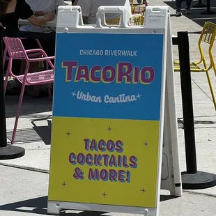 a sign for taco&apos;s, cocktails and more