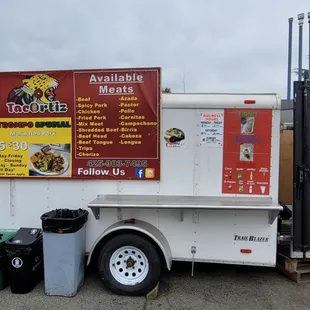 a food truck parked on the side of the road