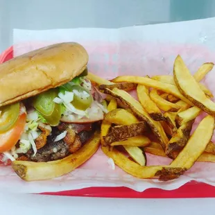 a hamburger and fries in a basket