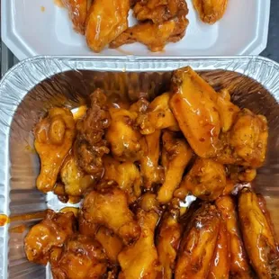 two trays of chicken wings