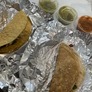 a tortilla, salsa and condiments