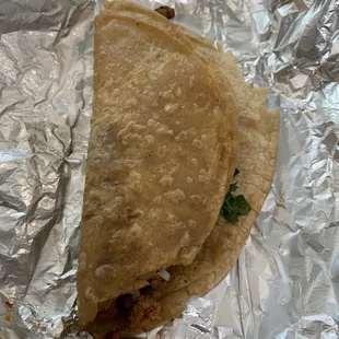 a taco wrapped in foil