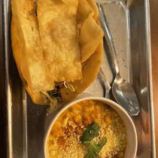 a bowl of soup and some tortillas