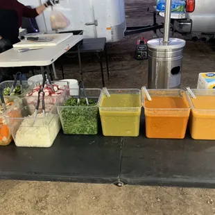 a table with a variety of tacos