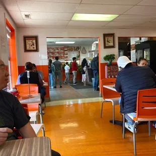 a man sitting at a table in a restaurant