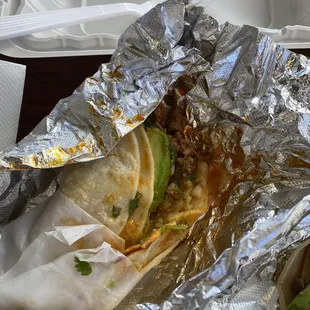 a taco wrapped in foil