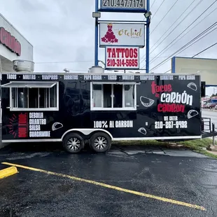 a taco truck parked in a parking lot