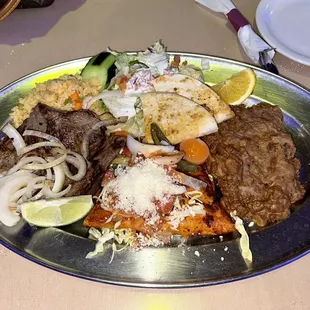 Appetizer Combo Plate with Asada, quesadilla, enchiladas &amp; Refried Beans with Sausages