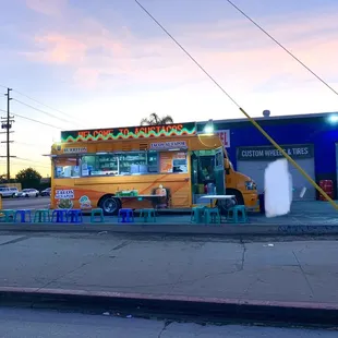 a taco truck parked on the side of the road