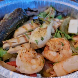 a bowl of shrimp and vegetables
