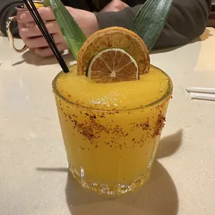 Frozen mango margarita with Tajin rim