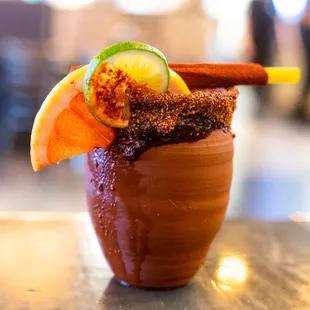 Our Delicious Cantarito!!! Gold Agave, Orange and Grapefruit Juice, Grapefruit Soda, Lime, Pinch of Salt.
Chamoy Rim.