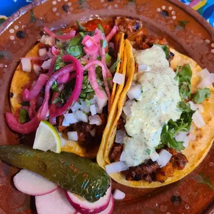 Taco al pastor and tacos cochinita pibil