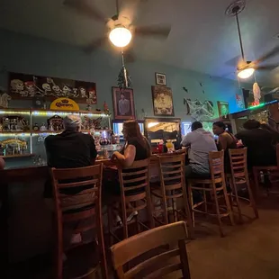 people sitting at a bar