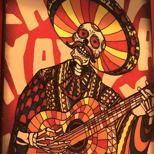 Los Muertos tocan guitara Day of the Dead